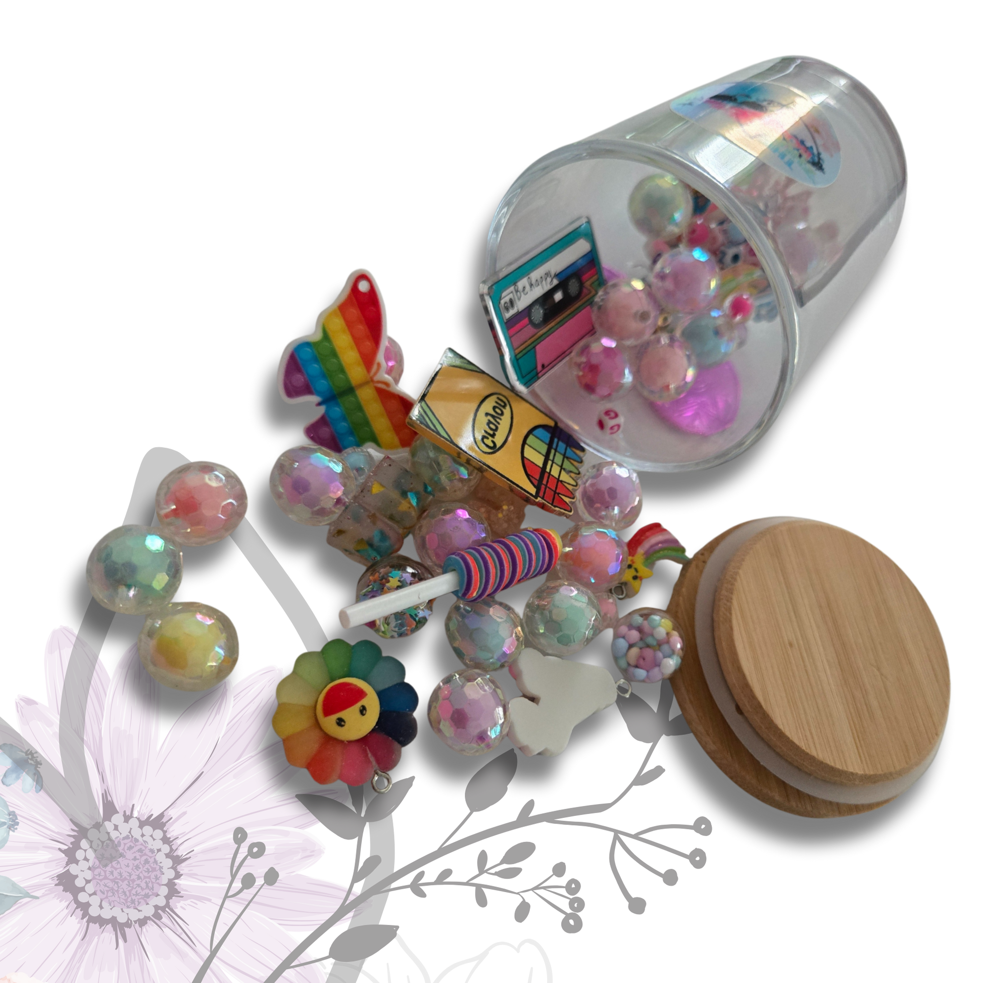 Colorful decorative items including beads, a wooden object, and a small container on a white background.